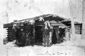 10.-Cabin-with-woman-in-front.jpg
